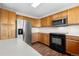 Charming kitchen featuring stainless steel appliances and ample cabinet space at 9638 Marion Way, Thornton, CO 80229