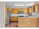 Well-equipped kitchen with stainless steel appliances and bright lighting at 9638 Marion Way, Thornton, CO 80229