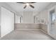Bright bedroom with mirrored walls, sliding glass doors, and ample closet space at 185 S Sable Blvd # T18, Aurora, CO 80012