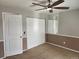 Bedroom with carpet, a door, and sliding closet doors at 185 S Sable Blvd # T18, Aurora, CO 80012