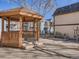 Inviting outdoor gazebo with benches and a grill for entertaining in a landscaped community space at 185 S Sable Blvd # T18, Aurora, CO 80012