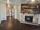 Open-concept living area with wood-like floors and view of the kitchen, creating a cohesive and inviting atmosphere at 185 S Sable Blvd # T18, Aurora, CO 80012