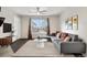 Comfortable living room with a stylish sofa, rug, and modern decor at 185 S Sable Blvd # T18, Aurora, CO 80012