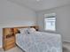 Bedroom with light colored walls and coordinated bedding at 18938 E 64Th Pl, Denver, CO 80249
