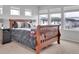 Comfortable bedroom with a large bed, neutral tones, and ample natural light at 18938 E 64Th Pl, Denver, CO 80249
