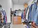 Walk-in closet with clothing racks, shelves, dresser, and plenty of storage space at 18938 E 64Th Pl, Denver, CO 80249