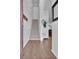 Inviting home entryway featuring hardwood floors and a staircase leading to the upper level at 18938 E 64Th Pl, Denver, CO 80249