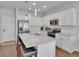 Beautiful kitchen with white cabinets, stainless steel appliances, and a large center island at 18938 E 64Th Pl, Denver, CO 80249