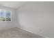 Well lit bedroom with neutral carpet, a window, and fresh paint at 20520 E 58Th Ave, Aurora, CO 80019