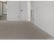 Bright bedroom features neutral carpet, fresh paint, and easy access to the ensuite bathroom at 20520 E 58Th Ave, Aurora, CO 80019