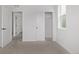 Bright bedroom features plush carpeting, a sliding door closet, and neutral paint scheme at 20520 E 58Th Ave, Aurora, CO 80019