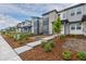 Charming street showcasing modern townhomes with attractive facades and landscaped yards at 20520 E 58Th Ave, Aurora, CO 80019