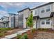Stylish townhome boasts contemporary stonework, landscaping, and an inviting entryway at 20520 E 58Th Ave, Aurora, CO 80019