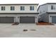 Attached garages provide convenience and blend seamlessly with the home's exterior at 20520 E 58Th Ave, Aurora, CO 80019