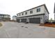 Garage doors to new homes showcase modern design, ample parking and curb appeal at 20520 E 58Th Ave, Aurora, CO 80019