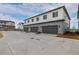 Modern three-car garage featuring individual doors and ample parking space at 20520 E 58Th Ave, Aurora, CO 80019