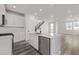 Modern kitchen features stainless steel appliances and a sleek island sink at 20520 E 58Th Ave, Aurora, CO 80019