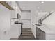 Modern white kitchen with stainless appliances and gas range at 20520 E 58Th Ave, Aurora, CO 80019