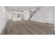 Spacious living room showcases an open floor plan and modern stairs at 20520 E 58Th Ave, Aurora, CO 80019