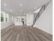 Bright, open floor plan featuring modern finishes and contemporary stairs at 20520 E 58Th Ave, Aurora, CO 80019