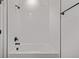 Clean shower boasts white subway tile, modern fixtures, and a relaxing bathing space at 20520 E 58Th Ave, Aurora, CO 80019