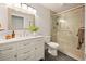 Modern bathroom with a large vanity, glass shower and neutral tones at 7946 Chase Cir # 112, Arvada, CO 80003