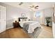 Comfortable bedroom with a large bed, neutral colors, and ceiling fan at 7946 Chase Cir # 112, Arvada, CO 80003