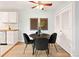 Cozy dining area with a round table, modern chairs, and stylish decor, perfect for intimate meals at 7946 Chase Cir # 112, Arvada, CO 80003