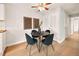 Bright dining area with a modern table, chairs, and light fixture at 7946 Chase Cir # 112, Arvada, CO 80003