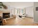 Spacious living room featuring a fireplace and white walls at 7946 Chase Cir # 112, Arvada, CO 80003