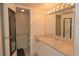 Bathroom with sink, vanity, and mirror at 799 Dahlia St # 201, Denver, CO 80220