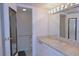 Bathroom featuring vanity with marble countertop and open access to the shower at 799 Dahlia St # 201, Denver, CO 80220