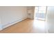 Bright bedroom offers wood floors and access to balcony at 799 Dahlia St # 201, Denver, CO 80220