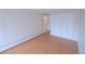 Bedroom featuring wood floors and double closets with access to a hall at 799 Dahlia St # 201, Denver, CO 80220
