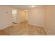 Open floor plan featuring neutral walls, tile flooring, kitchen and living room area at 799 Dahlia St # 201, Denver, CO 80220