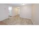 Living room features neutral walls and tile floors with an entrance to the kitchen at 799 Dahlia St # 201, Denver, CO 80220