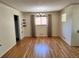 Dining area with hardwood floors, a chandelier, and window for natural light at 2124 S Yates St, Denver, CO 80219