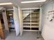 This is a spacious storage area with an open storage unit and plenty of shelves to maximize space at 2124 S Yates St, Denver, CO 80219