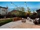 Relaxing backyard patio area with comfortable seating and ambient string lights at 2794 Lima St, Denver, CO 80238