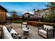 Cozy outdoor seating area with modern furniture and string lights for evening gatherings at 2794 Lima St, Denver, CO 80238