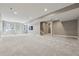 Large finished basement with recessed lighting, windows, and space for various activities at 2794 Lima St, Denver, CO 80238