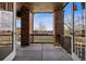Inviting covered patio featuring brick columns and stylish string lights for relaxed outdoor enjoyment at 2794 Lima St, Denver, CO 80238