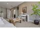 Neutral living area with desk space, a white sofa, and natural light creating an open space at 2794 Lima St, Denver, CO 80238