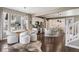 Open-concept living space with modern dining and kitchen area, with hardwood floors and neutral décor at 2794 Lima St, Denver, CO 80238