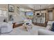 Open-concept living area that showcases the seamless connection of living room, dining area and modern kitchen at 2794 Lima St, Denver, CO 80238