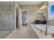 This main bathroom includes a soaking tub, vanity, and shower, offering a spacious and luxurious area at 2794 Lima St, Denver, CO 80238