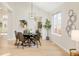 Dining area with a round table, four chairs, and hardwood floors at 6716 W 97Th Cir, Broomfield, CO 80021