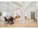 Open concept dining area with hardwood floors and modern light fixture at 6716 W 97Th Cir, Broomfield, CO 80021