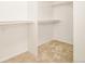 Spacious walk-in closet with double rods and neutral carpeting at 6716 W 97Th Cir, Broomfield, CO 80021