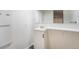 Clean basement bathroom with sink, vanity, and mirror at 897 S Granby Cir, Aurora, CO 80012